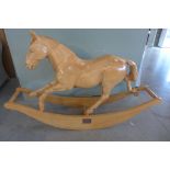 A good quality handmade wooden rocking horse, called Eridanus by Michael Pearson, carved in