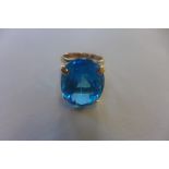 An unmarked gold ring, set with large blue topaz stone, size M/N, approx 10 grams, good condition