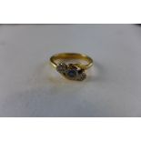 An un-hallmarked gold diamond and sapphire ring, size L, tests to approx 18ct, approx weight 4