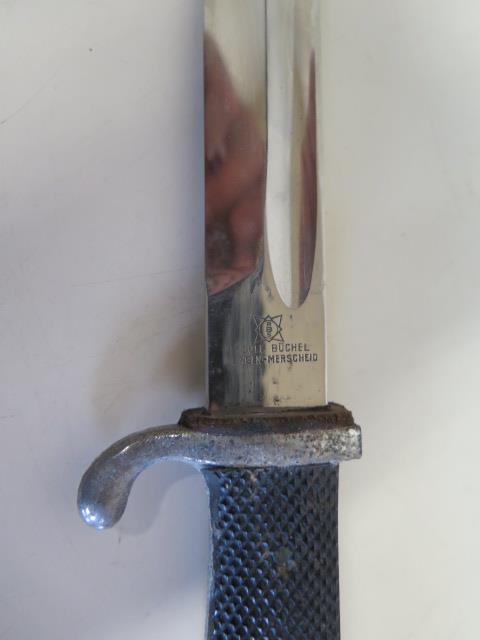 A German Rudolf Buchel bayonet and scabbard, engraved Ph Amend 1939, and another bayonet with wooden - Image 4 of 7