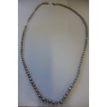 An opera length silver graduated bead necklace, approx 62 grams, 77cm long