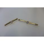 Two gold and opal stick pins, one marked 15ct with an oval stone, weight approx 2.5 grams, and the