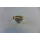 A hallmarked 9ct diamond cluster ring in heart shaped setting, 0.25ct total diamond weight, size