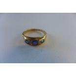 A hallmarked 18ct sapphire and diamond ring with engraved shoulders, size L, approx 4 grams, some