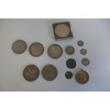 A collection of coins to include three silver dollars, two 1886 and 1884, a Georgian and Victorian