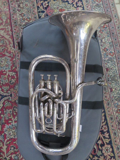 A Boosey and co ltd large bore Solbron Class A tuba 133784 with soft case, some multiple denting