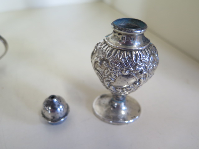 A silver embossed three piece cruet set, hallmarked Birmingham 1909 - by Joseph Glostor Ltd, - Image 5 of 6