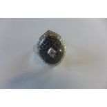 A hallmarked 14ct white gold ring, set with white and black diamonds, size Q, approx 6.6 grams, in