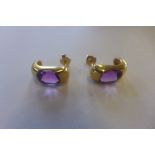 A pair of hallmarked 18ct amethyst set earrings, 15mm long, approx 4.6 grams, in good condition