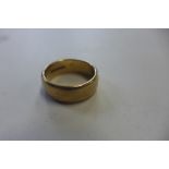 A hallmarked 9ct yellow gold band ring, size T, approx 9 grams