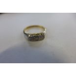 An 18ct platinum three stone diamond ring, size L, approx 2.8 grams, marked 18ct plat