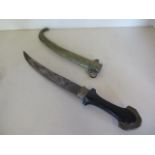 An Eastern curved dagger with ornate brass scabbard and hardwood handle, blade length 23cm,