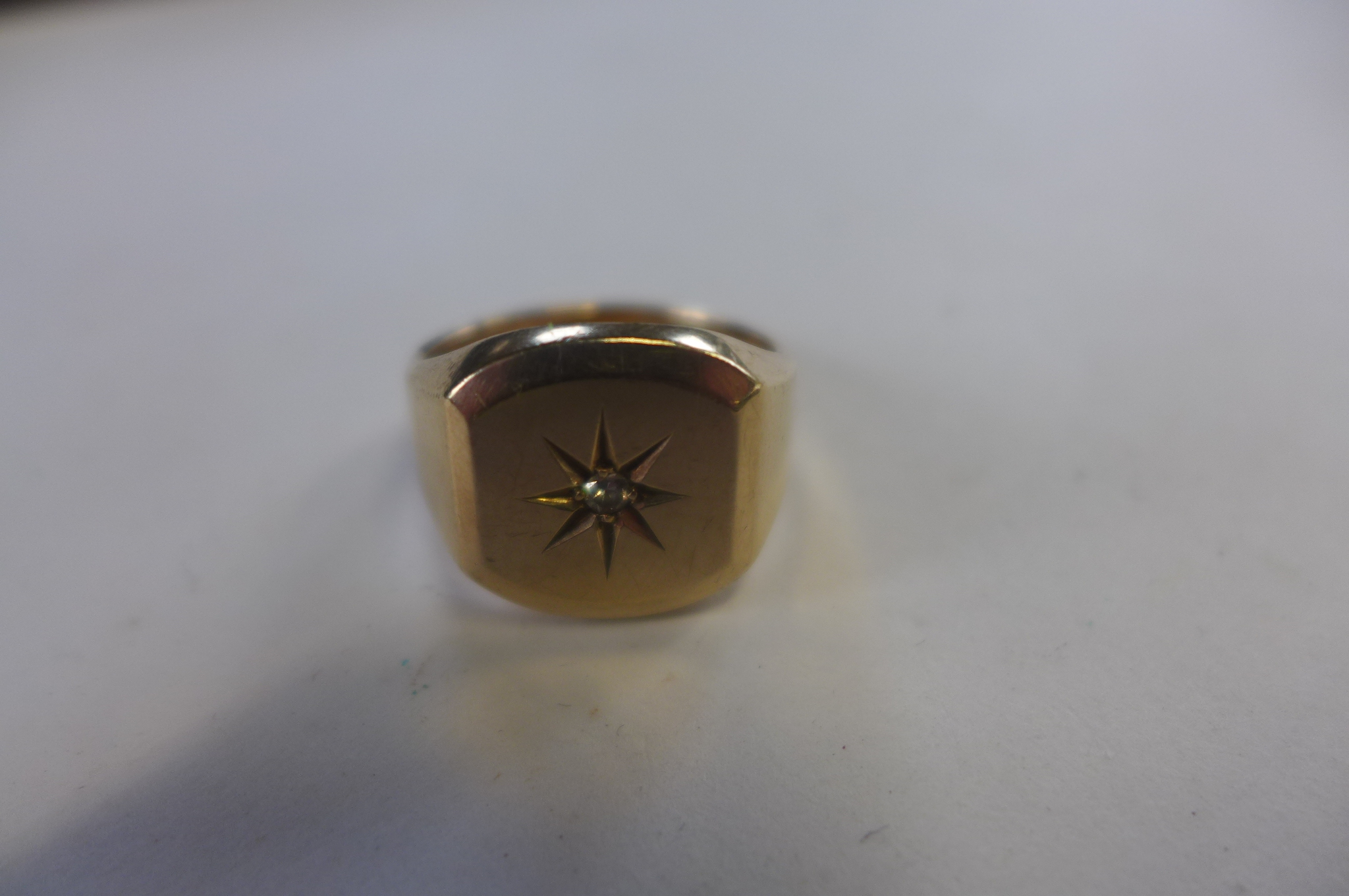 A hallmarked 9ct gold diamond signet ring, size R, approx 10.8 grams, general usage marks, hallmarks