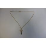 A hallmarked 9ct crucifix on a 9ct chain, marked 9ct, total weight approx 2.4 grams