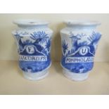 A pair of 19th century Dutch Delft blue and white pedestal drugs jars, painted with stags and