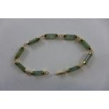 A 14ct gold jade bracelet, 18cm long, approx 6.4 grams, generally good condition