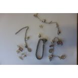 Three charm bracelets and various charms, some loose, approx 100 grams