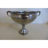 An Arts and Crafts hammered 935 silver twin handle cup, 13cm tall x 17cm wide, approx 9.3 troy oz,