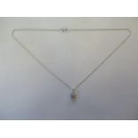 An 18ct white gold diamond pendant and chain, approx 2.9 grams, pendant 8mm square, in good
