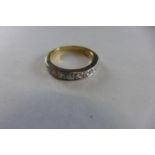 A very pretty nine stone diamond half eternity 18ct gold ring, the diamonds, each measuring approx 5