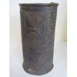 A Nigerian Benin Bronze wrist cuff of tapering cylindrical form, flange rims, decorated with ribbing