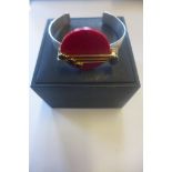 A silver designer Paula Bolton bangle in original box, in good condition