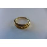 A hallmarked 9ct channel set citrine ring, size N, approx 2 grams, generally good