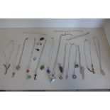 An assortment of silver and other necklaces, pendants and bracelets