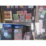 A large collection of foreign stamps, on small stock cards, MNH, MM and good /fine used with many