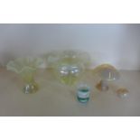 Two iridescent yellow glass vases 13cm, two iridescent art glass mushroom ornaments, 12cm and 4cm