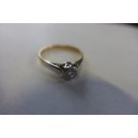An 18ct gold diamond solitaire ring, marked 18ct, size P, approx 2.2 grams, some general usage