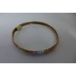 A tri-colour 9ct gold segmented and woven links with diamond design bracelet, import duty marks