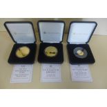 Two gold plated silver proof £5 coins, and a 9ct 2.75 gram 60th Anniversary coin, all Tristan da