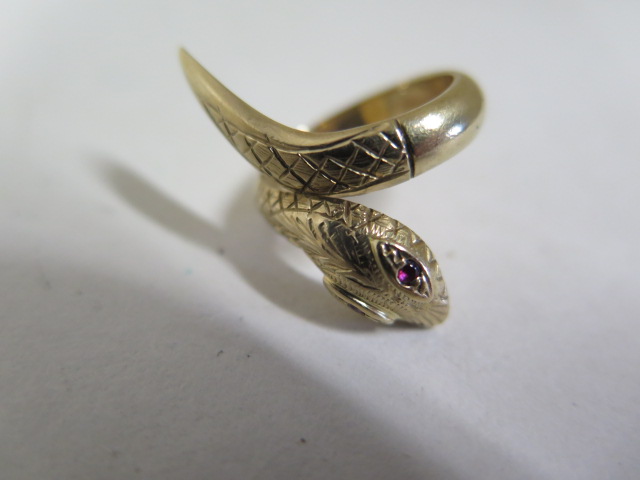 A 9ct yellow gold snake ring, single, coil with textured head and tail detail, set with two - Image 2 of 2