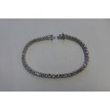 A good 18ct white gold diamond tennis bracelet, set with 47 round brilliant cut diamonds, total 9.