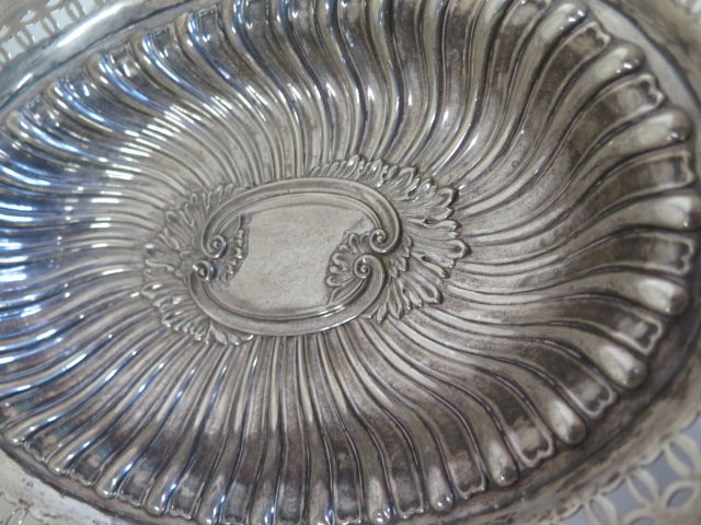 An embossed silver basket with pierced border, Birmingham 1895/96 approx 21.4 toy oz, 24cm tall with - Image 3 of 7