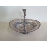 An embossed silver basket with pierced border, Birmingham 1895/96 approx 21.4 toy oz, 24cm tall with