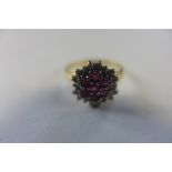 A hallmarked 18ct ruby and diamond gold ring, size K, approx 2.8 grams, generally good