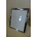 A large silver photo frame, 30x25cm - minor denting otherwise good