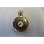 A 9ct gold half hunter pocket watch, hallmarked London 1925, the white enamel face with Roman