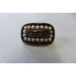A gilt metal and pearl mourning brooch, 2.5cm long, approx 5.8 grams