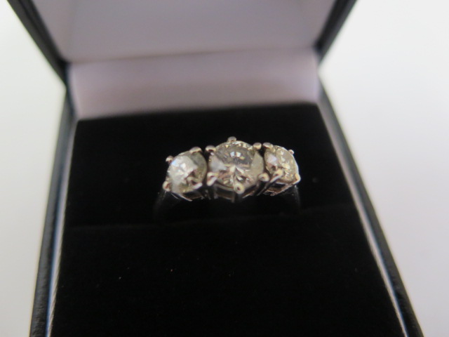 A three stone diamond trilogy ring set in 18ct white gold, approx 1.75ct total, size M, marked 18K - Image 6 of 6