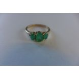 A hallmarked 9ct emerald and diamond ring, size O, approx 2.2 grams, generally good condition
