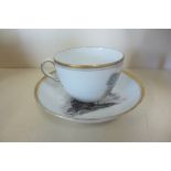 A 19th century transfer decorated tea cup and saucer with stately home and a country scene, some