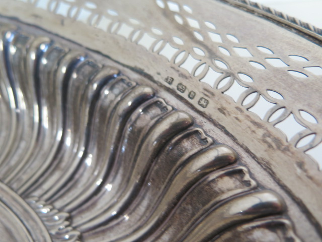 An embossed silver basket with pierced border, Birmingham 1895/96 approx 21.4 toy oz, 24cm tall with - Image 2 of 7