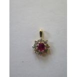 A hallmarked diamond and ruby pendant