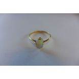 An 18ct opal ring, marked 18ct, size Q, approx 1.9 grams, in generally good condition