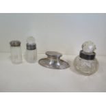 A silver Capstan inkwell, two silver rimmed bottle and a silver top bottle
