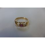 A hallmarked 18ct yellow gold diamond and ruby ring, size S, approx 2.3 grams, some wear but no