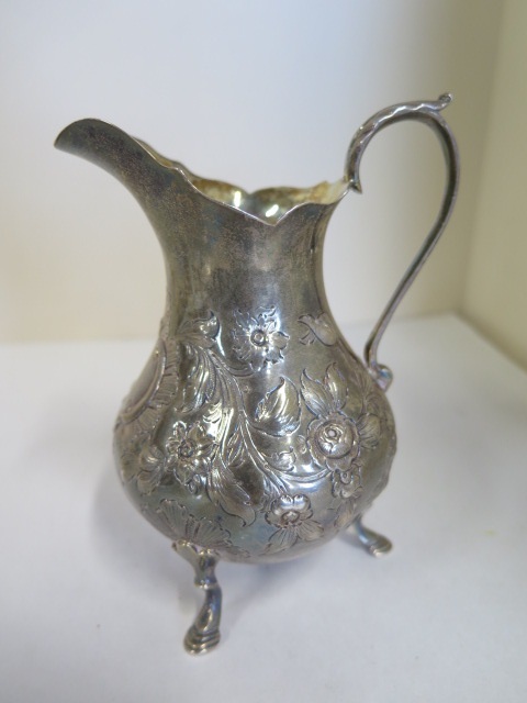 A Victorian embossed silver cream jug - 1847 - makers mark rubbed, height 23.5cm weight 4.7 troy